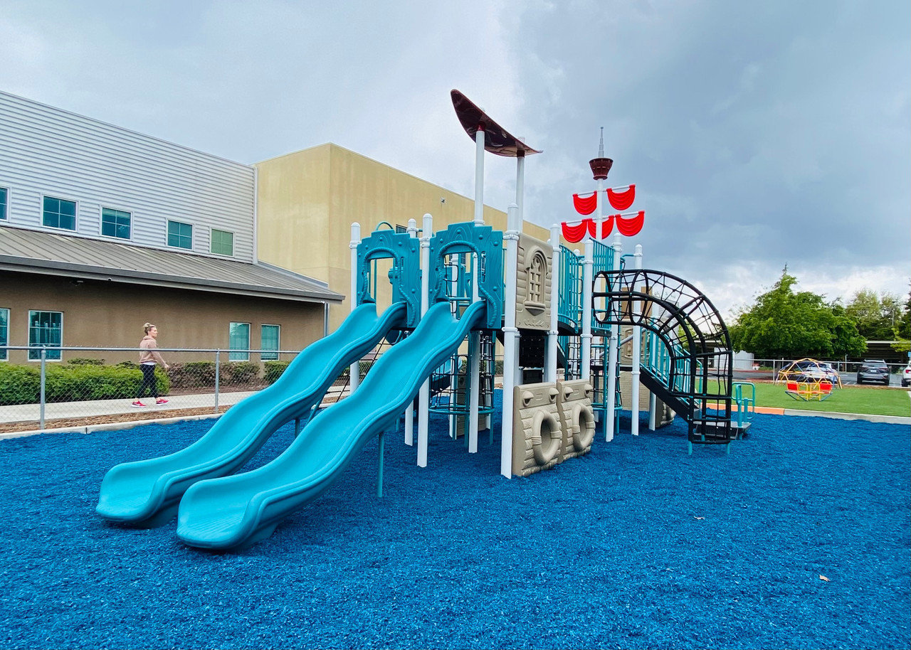 Blue Rubber Mulch Blue Rubber Mulch with one of our custom Pirate Ship Play Structures